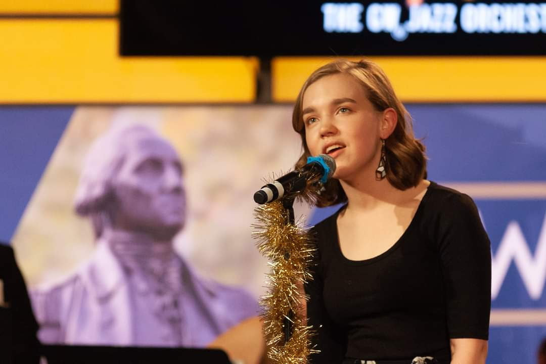 Ellie D'Andria singing at the GW Jazz Orchestra’s 2021 holiday concert