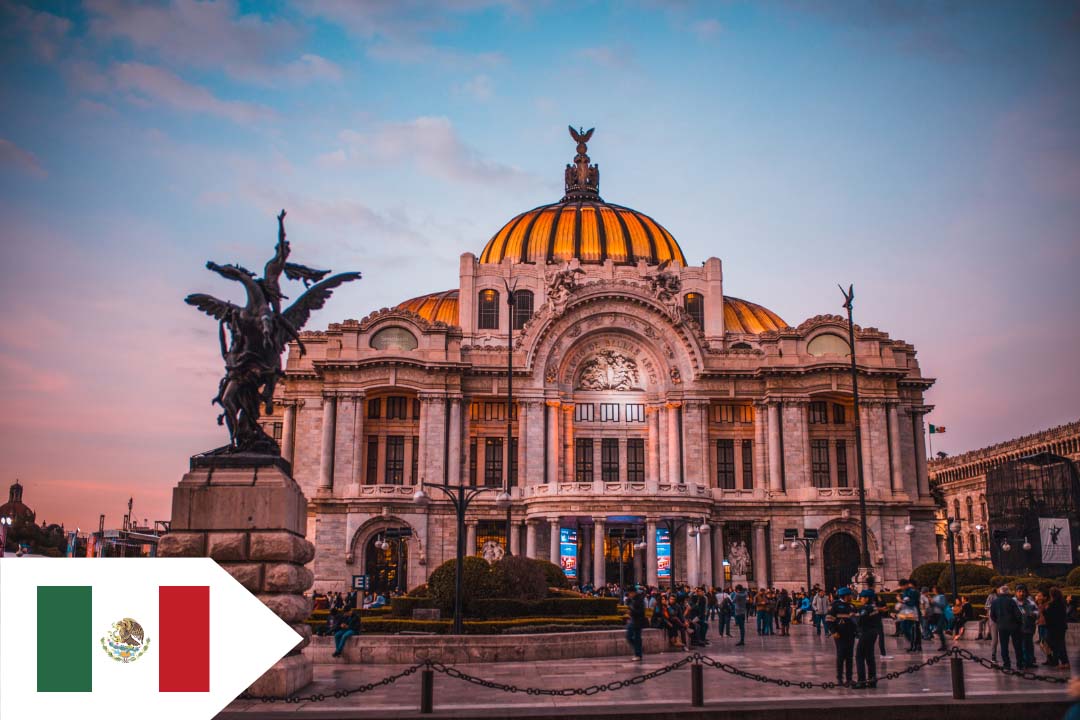 A stone building lit up at night