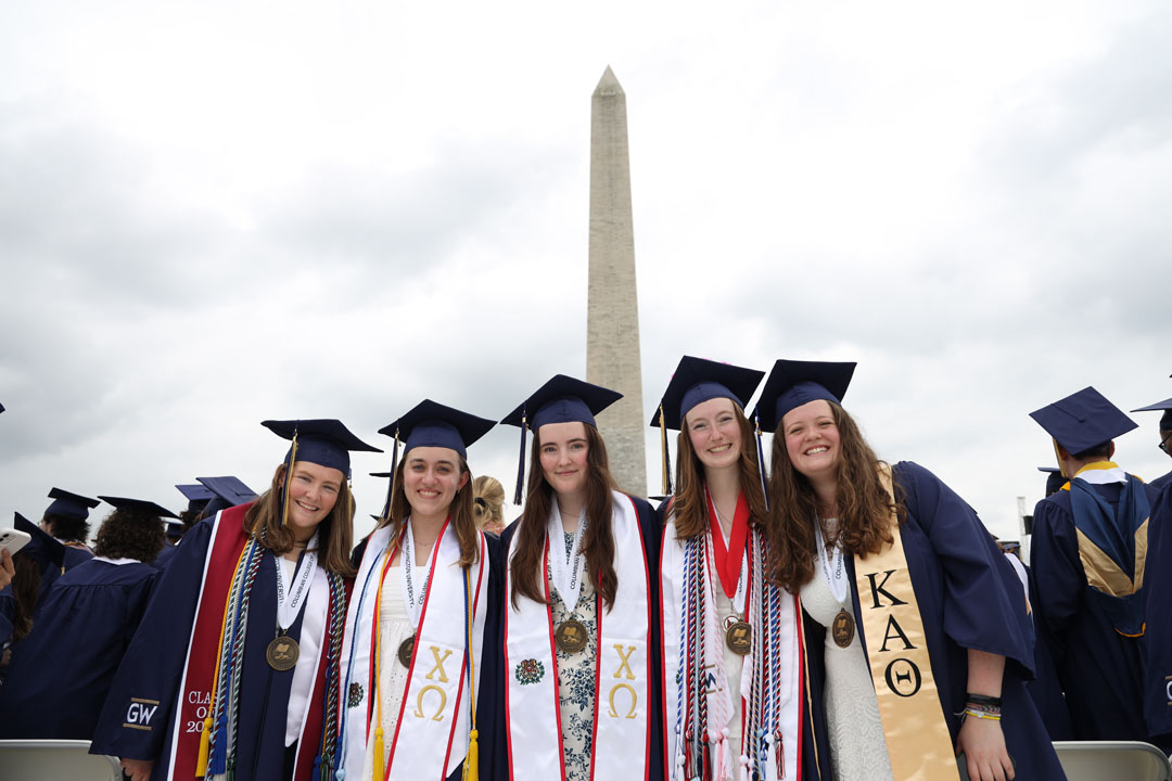Recent graduates in caps, gowns and tassels at the 2024 GW Commencement on the National Mall
