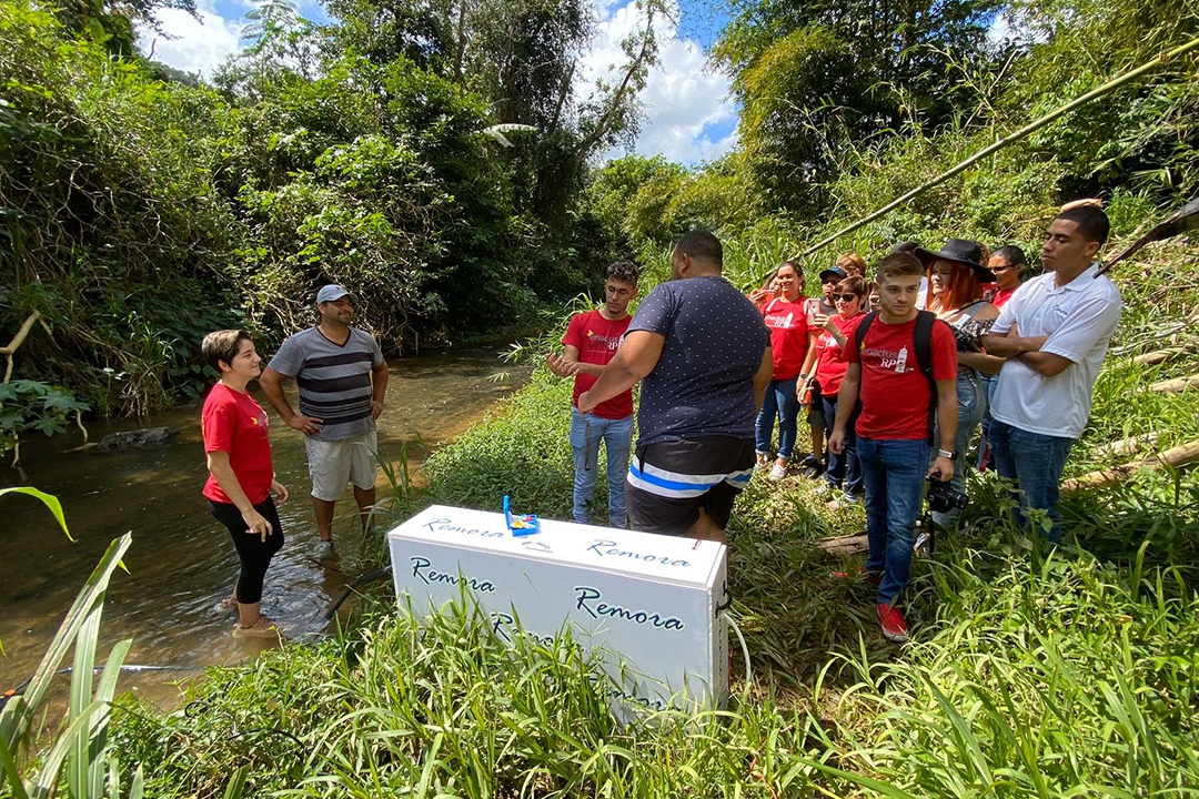 Negron-Ocasio (center) and his team installing the first Remora water filtration device at a river in Corozal