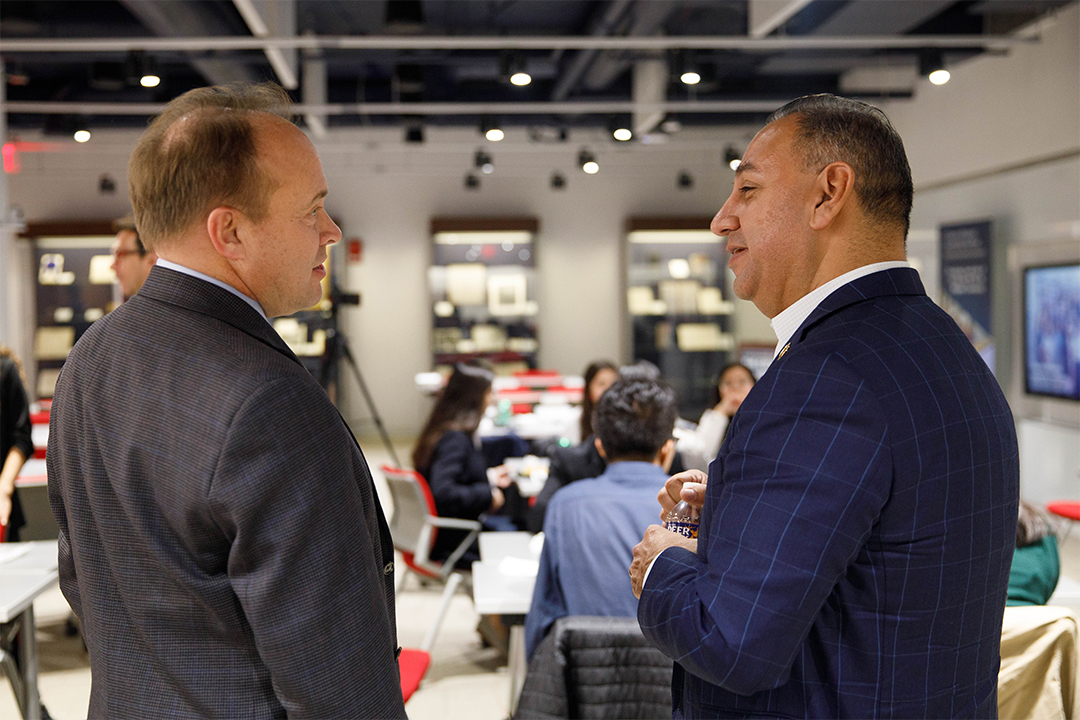 Wahlbeck with philanthropist and U.S. Congressman Gil Cisneros, BA ’94.