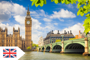 Big Ben and the Thames river set against a blue sky background