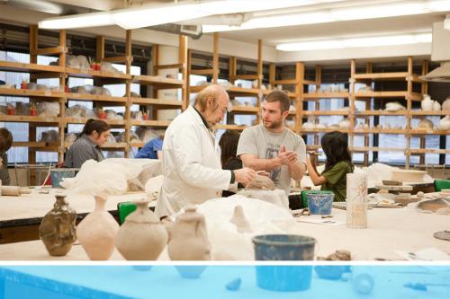 A student and professor in a room filled with pottery