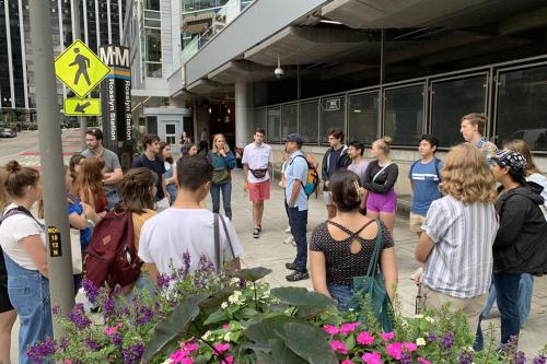 Transportation Planner Larry Marcus (center) talks to Rain’s class about how the streetscape at the Rosslyn, Va., increases walkability and provides bus access.