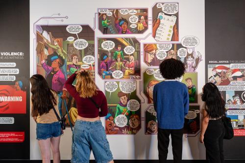 The exhibit features a comic book-style mural that helps visitors understand the social effects of cellphones