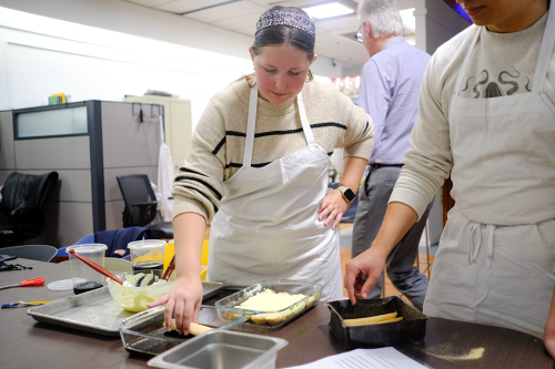 Sophomore Sophia Cekola puts the finishing touches on a tiramisu during a class kitchen session.
