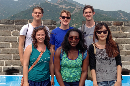Group of students smiling in front of a mountain view