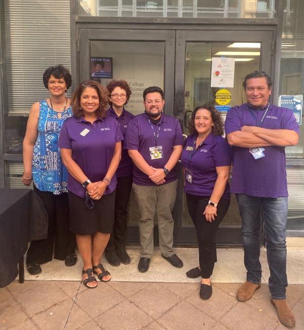 Six members of the CCAS Graduate Student Services Team standing together in front of Smith Hall 118