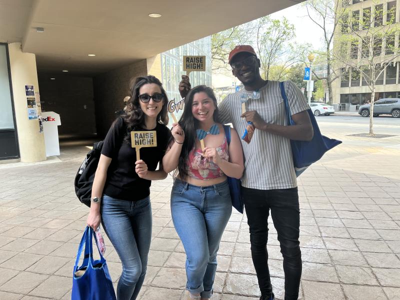 Three students pose at a GSAW event
