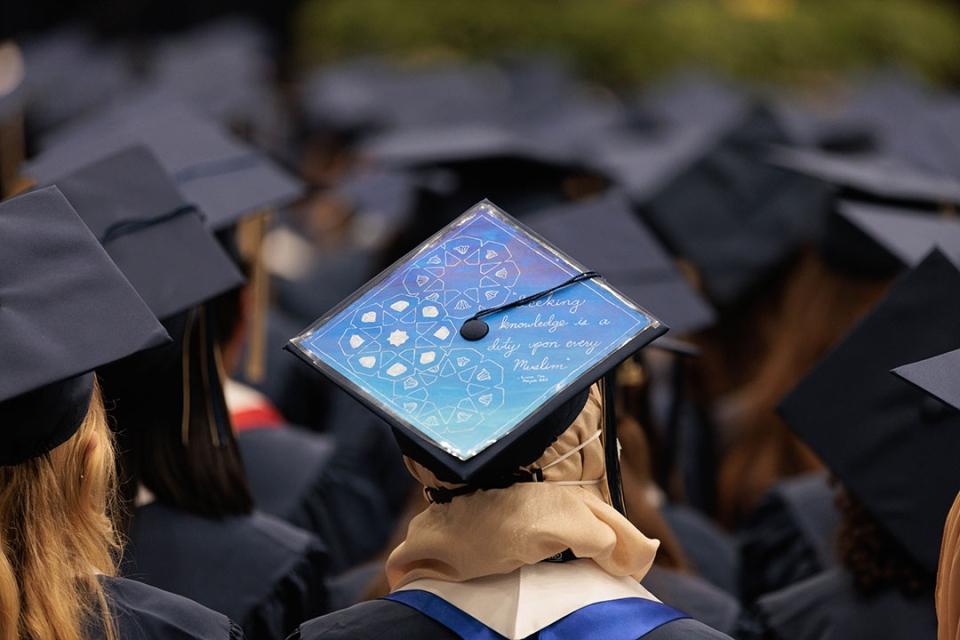 Grad cap decorated with the words "Seeking knowledge is a duty upon every Muslim."
