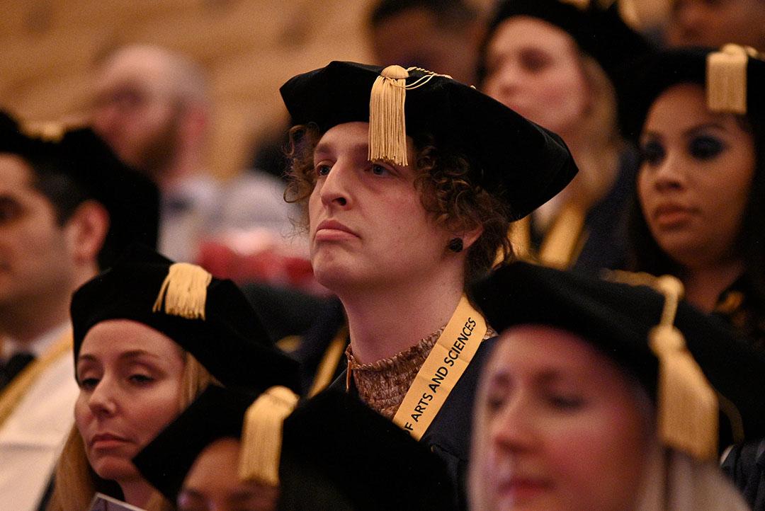 A CCAS doctoral graduate in regalia