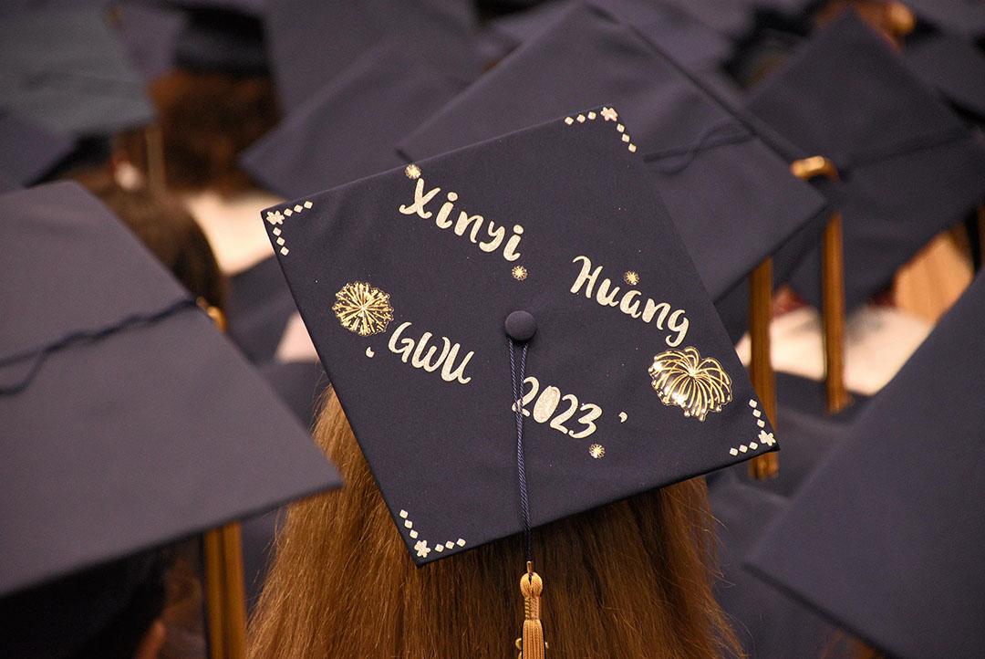 Graduation cap decorated with "Xinyi Huang, GWU 2023"