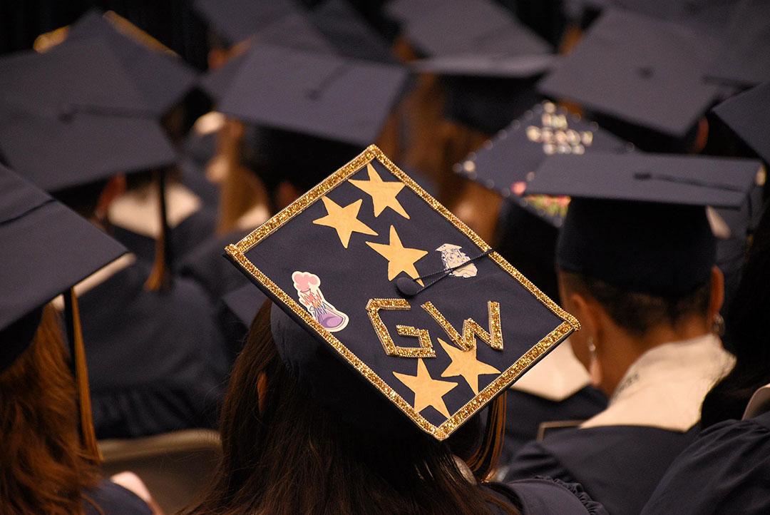 Graduation cap decorated with GW and stars on it