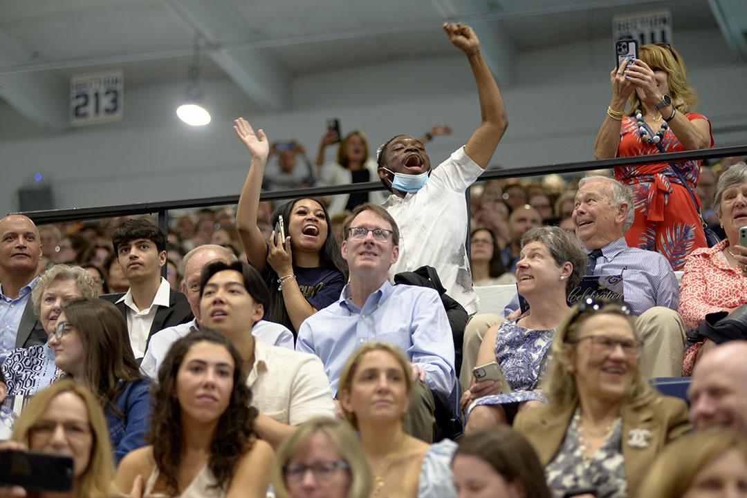 Families in the crowd cheering enthusiastically at CCAS Celebration