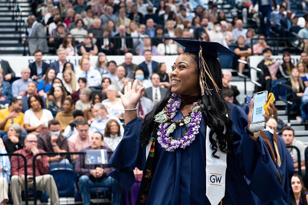 A CCAS master's student in cap and gown