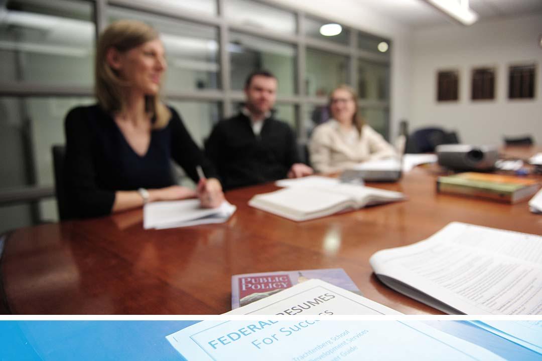 TSPPPA students at a table with papers showing career search resources