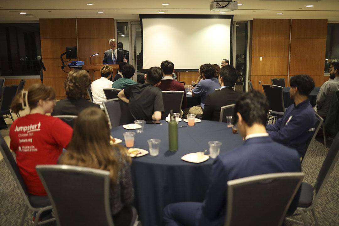 People sitting at round tables