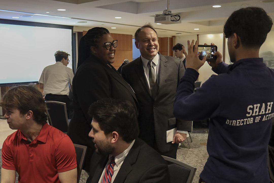 Dean Wahlbeck and a group of people talking