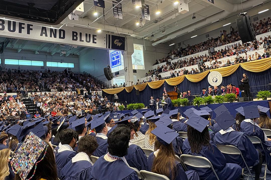 A crowd of undergraduate students in caps and gowns at GW's 2025 undergraduate celebration