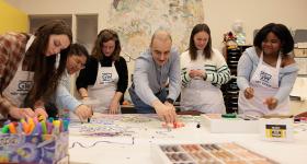 GW parent Ulvi Kasimov (center) endowed a fund to support graduate fellowships in the Art Therapy Program.