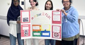 Students artun Hassan, Claire Belatti, Chloe Gordon and Mikal Armstrong in the GW SMART DC tutoring program present information to their peers on their community tutoring program partner, For Love of Children.